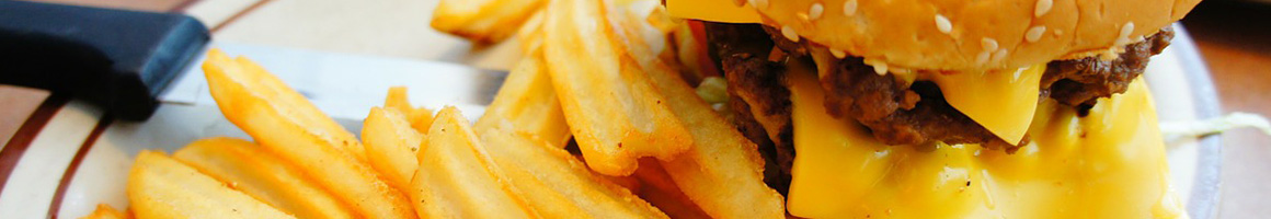 Eating Burger Greek Hot Dog at Flips Beef of Glen Ellyn restaurant in Glen Ellyn, IL.